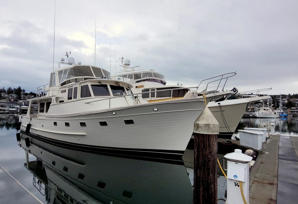Yacht docked at marina representing Larsen Marine’s yacht management services